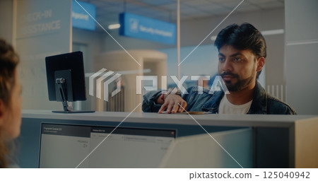 Airport Check-in Counter: Indian Man Verifying Personal ID Data by Facial Recognition Scanning 125040942