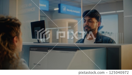 Airport Check-in Counter: Indian Man Verifying Personal ID Data by Facial Recognition Scanning 125040972