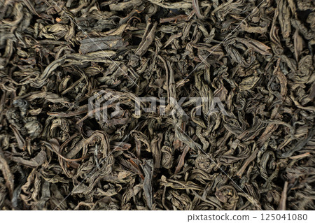 Dark and Twisted Ruhunu Tea Leaves. Pure Ceylon Tea Macro 125041080