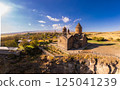 Aerial top view of Saghmosavank Monastery 13h centuries is located huge gorge canyon of Kasakh River. Church and Mount Ara on beckground in sunny summer day. Saghmosavan, Aragatsotn, Armenia, Europe 125041239