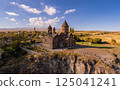 Aerial top view of Saghmosavank Monastery 13h centuries is located huge gorge canyon of Kasakh River. Church and Mount Ara on beckground in sunny summer day. Saghmosavan, Aragatsotn, Armenia, Europe 125041241