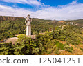 Aerial panoramic view of statue of Mother of Georgia Kartlis Deda by georgian sculptor Elguja Amashukeli from drone. Monument overlooking Tbilisi City from Sololaki Hill. Erected in 1958. Europe. 125041251