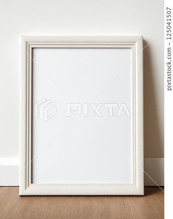 Blank picture frame on white wall background 125041507