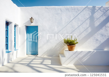 Dayllght greece courtyard with shadow on white wall. Beautiful Mediterranean style background 125041531