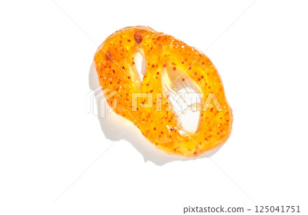 Close up of bright orange sliced kiwano fruit with seeds on white background Close up of bright orange sliced kiwano fruit with seeds on white background 125041751