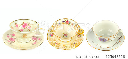 Porcelain vintage cup and saucer isolated on white background. Vintage Bavarian teaware. 125042528