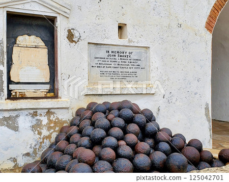 Elmina Castle Accra Ghana building and cannonballs 125042701
