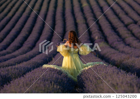 Lavender Fields Provence Woman: Yellow Dress photoshoot in French Lavender fields during summer showcasing beauty and serenity. 125043200