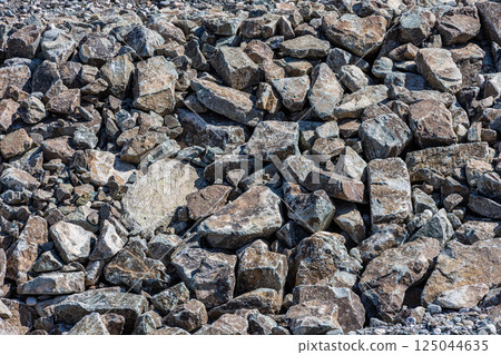 Rock pile, boulder field, rough terrain, natural stone, outdoor, daylight 125044635