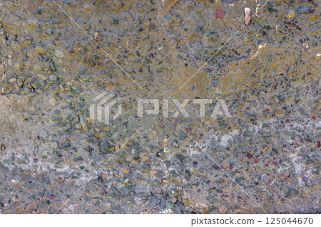 Weathered Cheap Uneven Concrete Surface with Pebbles Weathered Cheap Uneven Concrete Surface with Pebbles 125044670