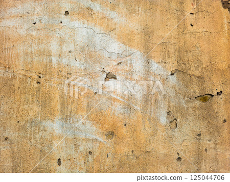 Aged beige stucco wall texture, weathered surface Aged beige stucco wall texture, weathered surface 125044706