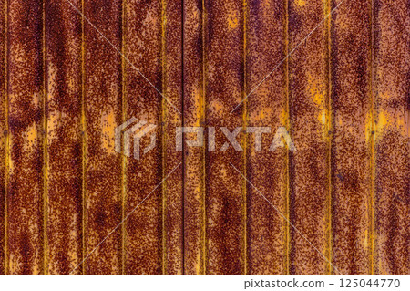 Vertical rusty speckled corrugated metal 125044770