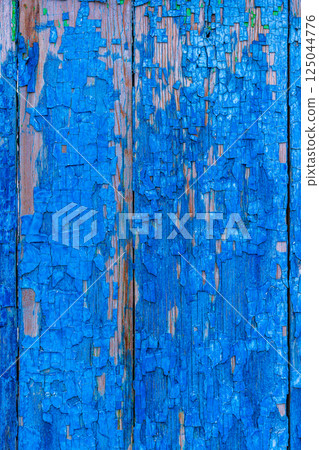 Peeling blue paint on wood 125044776