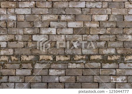 Rough Brick Wall with Minimal Mortar and Cracked Bricks Rough Brick Wall with Minimal Mortar and Cracked Bricks 125044777