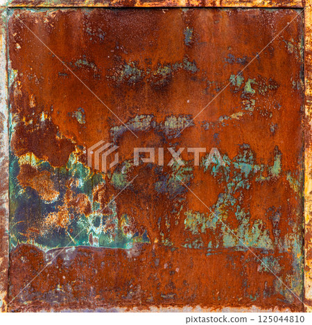 Rusty metal panel with frame and peeling green paint leftovers 125044810