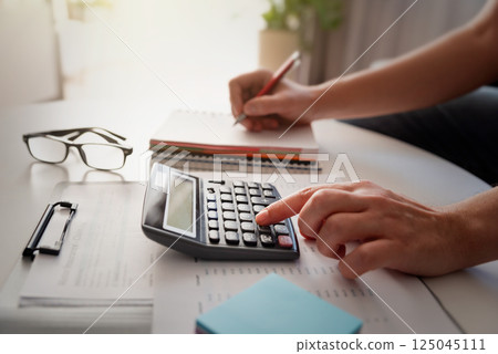 Man calculate finances, savings and taxes Man calculate finances, savings and taxes 125045111