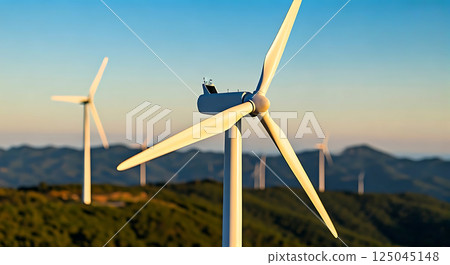 Close up horizontal picture of wind turbine .Blurred wind farm background. 125045148