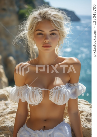 Beautiful woman relaxing by the sea, capturing leg details in high-definition with a stunning coastal backdrop under bright sunlight 125045700