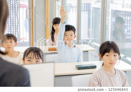 A teacher checking attendance in the homeroom in the morning A teacher checking attendance in the homeroom in the morning 125046843