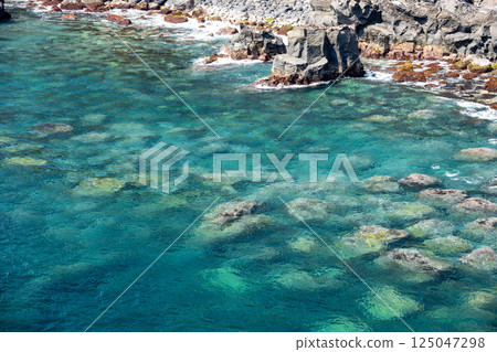 The clear blue waters of Jogasaki on the east coast of the Izu Peninsula The clear blue waters of Jogasaki on the east coast of the Izu Peninsula 125047298