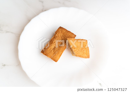 Two slices of baked goods on a white plate② Two slices of baked goods on a white plate② 125047327