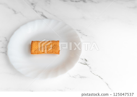 Baked goods and space on a white plate① Baked goods and space on a white plate① 125047537