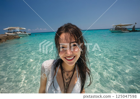 A woman enjoying a summer resort 125047598