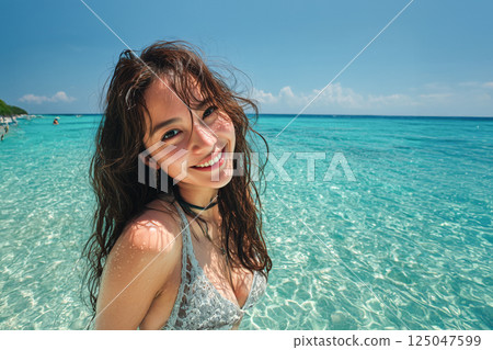 A woman enjoying a summer resort A woman enjoying a summer resort 125047599