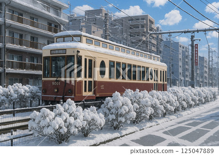 Streetcars and snowy scenery along the tracks 125047889