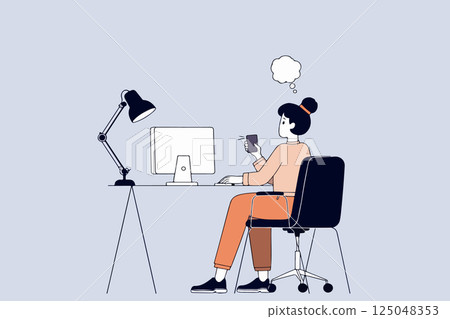 Woman Working at Computer with Phone 125048353