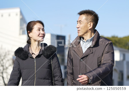 Middle-aged couple taking a walk 125050559