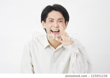 Man in his 20s talking on white background 125051238