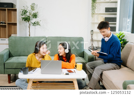 Group of young Asian college students working on his project assignment, using laptop computer 125053132