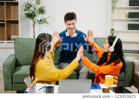 Group of young Asian college students working on his project assignment, using laptop computer 125053625