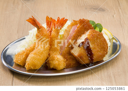 Assortment of three types of fried foods, including fried shrimp Assortment of three types of fried foods, including fried shrimp 125053861