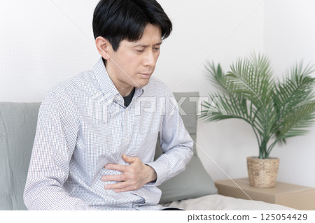 Man with stomach ache, stomach ache, gastroenteritis, diarrhea, constipation Man with stomach ache, stomach ache, gastroenteritis, diarrhea, constipation 125054429