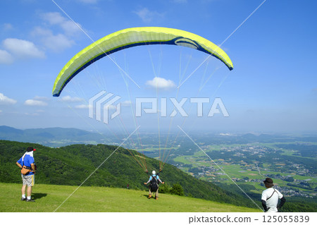 Early summer sky and paraglider 125055839
