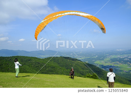 Early summer sky and paraglider 125055840