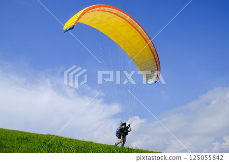 Early summer sky and paraglider Early summer sky and paraglider 125055842