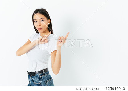 A woman is pointing to the sky with her finger 125056040