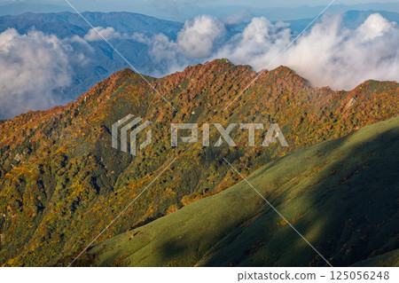 The Daigura Ridge in the evening light as seen from Mt. Gonishi in the Iide mountain range 125056248