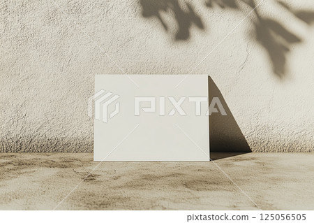 Blank Business Card Mockup on Concrete Floor with Neutral Tones 125056505