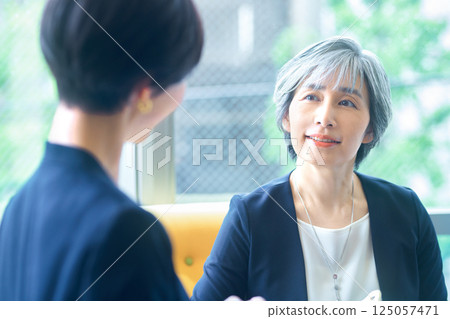 Senior business woman to have a meeting Senior business woman to have a meeting 125057471