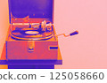 Old portable gramophone in vivid neon hues 125058660