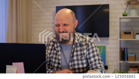 Professional man handling work and personal calls, multitasking evident in focused expression, multitasking essential for modern lifestyles, ideal for business and lifestyle videos. 125058881