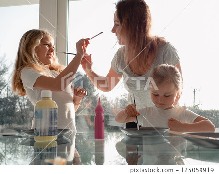 Family Painting Fun with Kids and Paintbrushes 125059919