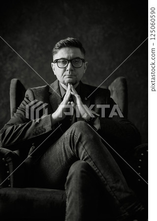 Monochromatic portrait of a serious man Monochromatic portrait of a serious man 125060590