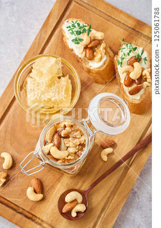 Honey-soaked nuts | Walnuts, almonds, cashews Honey-soaked nuts | Walnuts, almonds, cashews 125061788