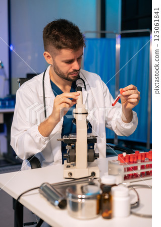 Doctor teleconference, analysis the blood test examination results and medication usage of the patient on the chart, medical check-up concept. 125061841