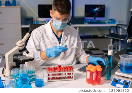 Glass vial, pipette and scientist in laboratory for medical study, research or experiment. Glass vial, pipette and scientist in laboratory for medical study, research or experiment. 125061860